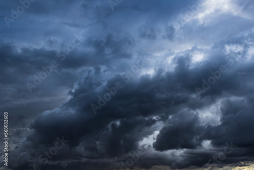 Dark ominous storm clouds create ethereal textured background element 