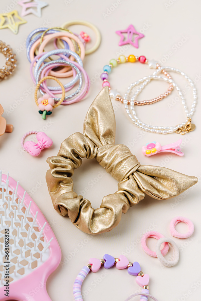Set of baby girl hair accessories. Fashion hair bows, hair clips, hairpins and hair elastics.  Hairstyles for girls with stylish accessory.