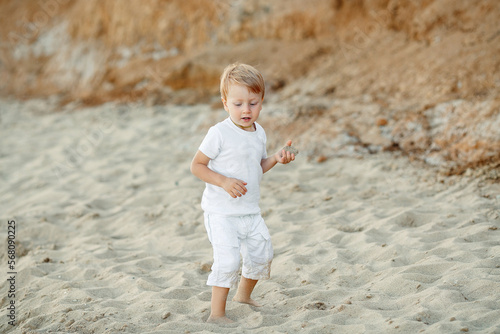 little child playing on the beach