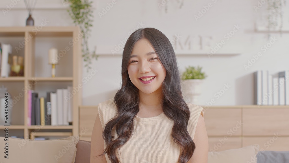Portrait of happy beautiful asian woman look at camera smile with positive emotional.Smart confident freelance woman smiling happiness with work at home or study young woman video call study online. Portrait of happy beautiful asian woman look at camera smile with positive emotional.Smart confident freelance woman smiling happiness with work at home or study young woman video call study online.