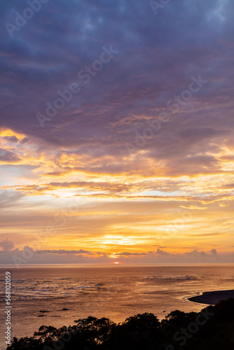 Orange and purple sunset reflection on ocean