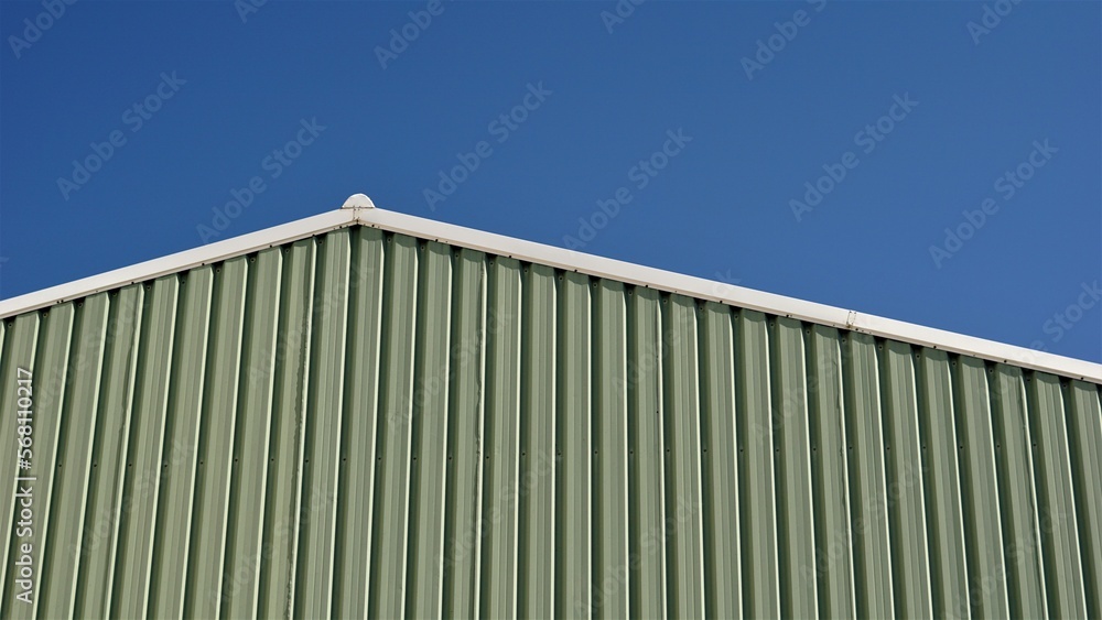 roof of industrial warehouse building against the sky roof of industrial warehouse building against the sky