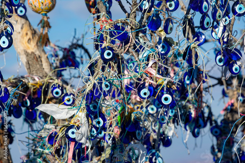 A variety of Nazar amulets hanging from a tree in Goreme.