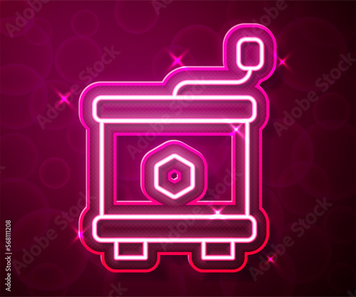 Glowing neon line Honey extractor icon isolated on red background. Mechanical device for honey extraction from honeycombs. Vector