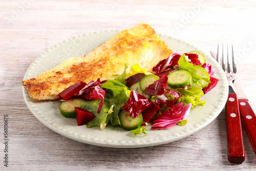 white fish fillet and salad