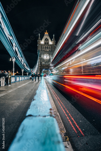 Fototapeta Naklejka Na Ścianę i Meble -  London Bridge over Thames in London by night with light trails long exposure