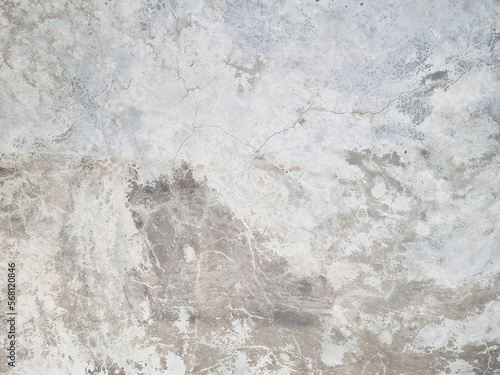 grey concrete wall - exposed concrete used as background with blank space for design. raw rustic cement background. cracked and weathered surrounding wall. © WONGSAKORN