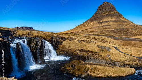 Famous Kirkjufell unique shaped Kirkjufell mountain and beautiful waterfall during spring season. Sn  fellsnes peninsula  Iceland