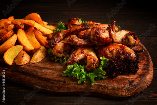 Fried chicken wings, with potatoes, and spices, homemade, fast food, no people,