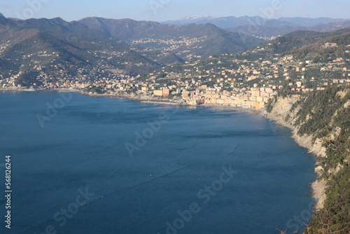 Camogli, Italy - January 28, 2023: An aerial view to the city of Camogli. Beautiful landscape from the ligurian sea with blue sky and mountains in the background.