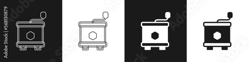 Set Honey extractor icon isolated on black and white background. Mechanical device for honey extraction from honeycombs. Vector