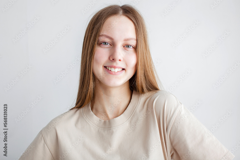 Portrait of young beautiful cute cheerful girl smiling over white background Portrait of young beautiful cute cheerful girl smiling over white background