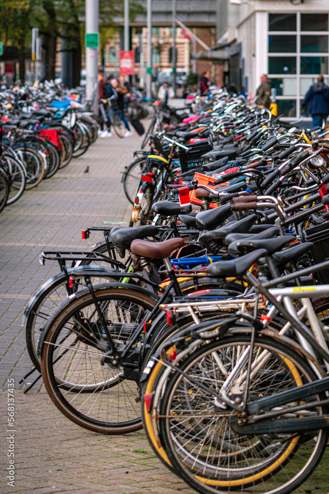 Bicycles parked in the streets of Amsterdam, the Netherlands. Green and sustainable transport. Alternative transportation.