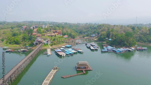 Wallpaper Mural Aerial top view of residential local floating houses in Mon village, nature trees with lake or river, Kanchanaburi, Thailand in urban city town in Asia, buildings. Torontodigital.ca