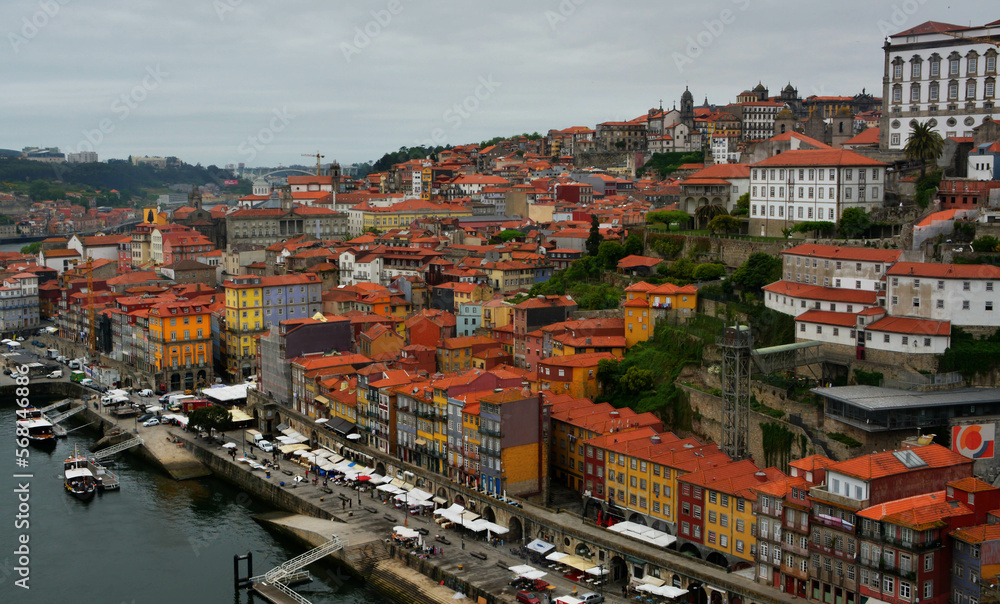 Panoramic view on Porto town with colorful buildings and red roofs. 