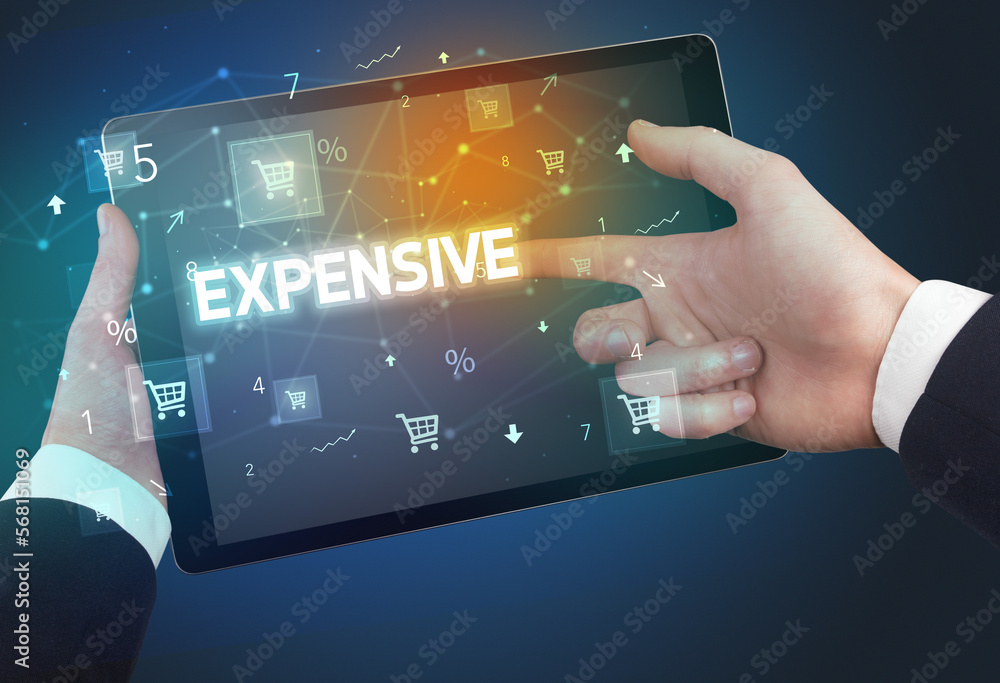 Close-up of a hand holding tablet with shopping inscription