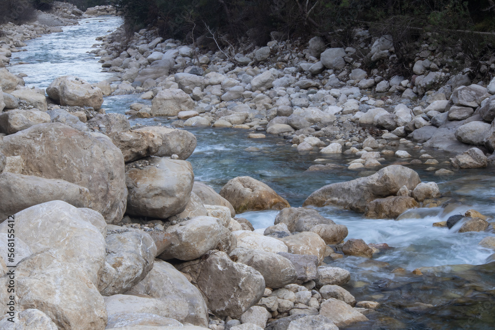 A mountain river with a strong current among the stones A mountain river with a strong current among the stones