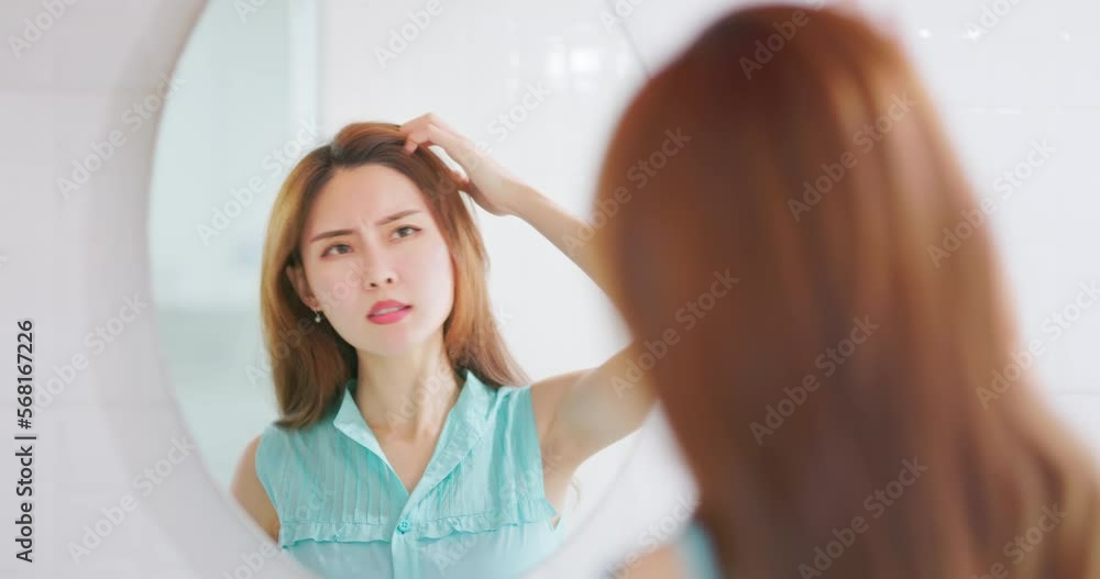 woman scratch head from itching woman scratch head from itching