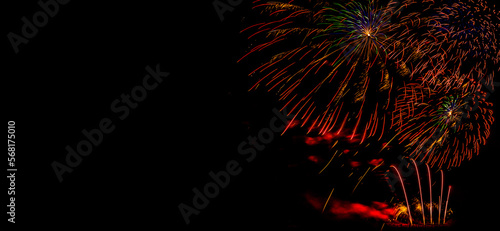 Obraz na płótnie Fireworks on a black background. Fireworks banner. Copy space. New Year and Celebration banner. Sparks salute isolated on black background. Festive banner with flashes of fireworks w salonie