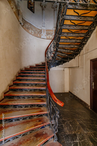 Old vintage spiral staircase at the old mansion