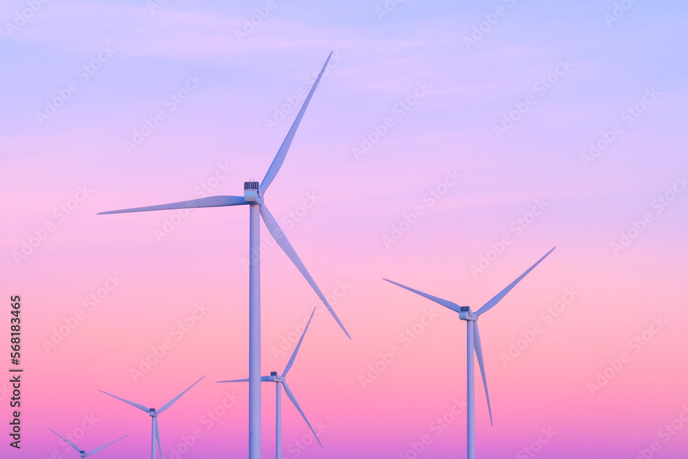 Renewable energy sources. Wind turbines on the shore. Netherlands. Bright sky during sunset. Wallpaper and background. Industrial image. Renewable energy sources. Wind turbines on the shore. Netherlands. Bright sky during sunset. Wallpaper and background. Industrial image.