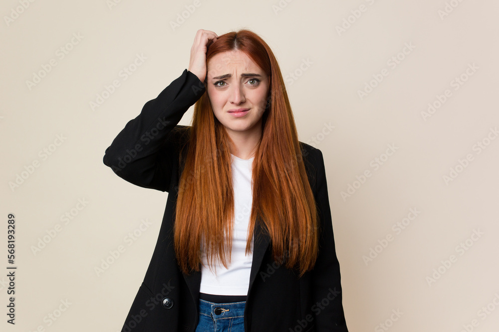 Young business caucasian redhair woman being shocked, she has remembered important meeting. Young business caucasian redhair woman being shocked, she has remembered important meeting.