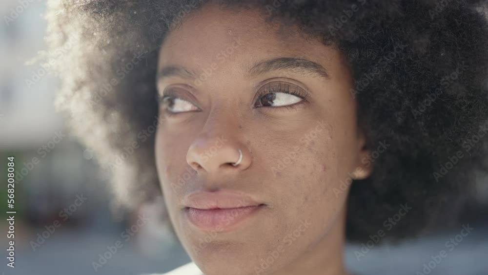 African american woman smiling confident looking to the side at street African american woman smiling confident looking to the side at street