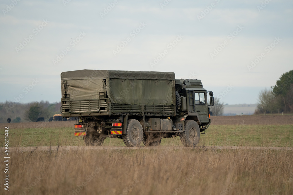 Fototapeta premium British army MAN SV 4x4 logistics lorry moving along a country track
