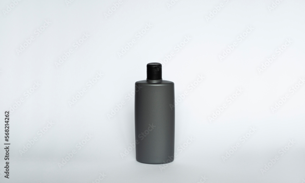 Grey blank plastic bottle for gel, liquid soap, lotion, cream, shampoo on white background. Cosmetics. Grey blank plastic bottle for gel, liquid soap, lotion, cream, shampoo on white background. Cosmetics.