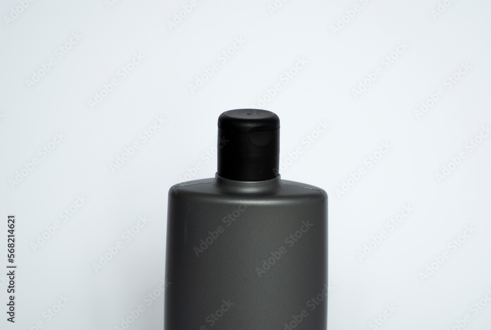 Close up grey blank plastic bottle for gel, liquid soap, lotion, cream, shampoo on white background. Cosmetics. Close up grey blank plastic bottle for gel, liquid soap, lotion, cream, shampoo on white background. Cosmetics.