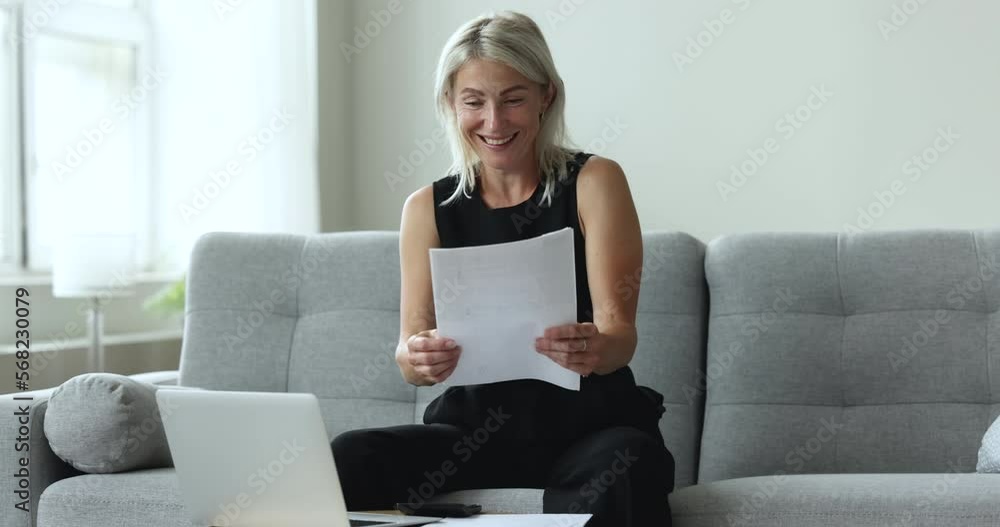 Happy mature woman relish success, business or personal achievement, reading good news in paper notification from bank feels overjoyed, makes Yes I did it gesture, get great opportunity. Luck, income Happy mature woman relish success, business or personal achievement, reading good news in paper notification from bank feels overjoyed, makes Yes I did it gesture, get great opportunity. Luck, income