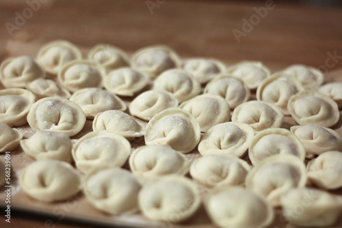 Fresh homemade dumplings handmade lie on the table