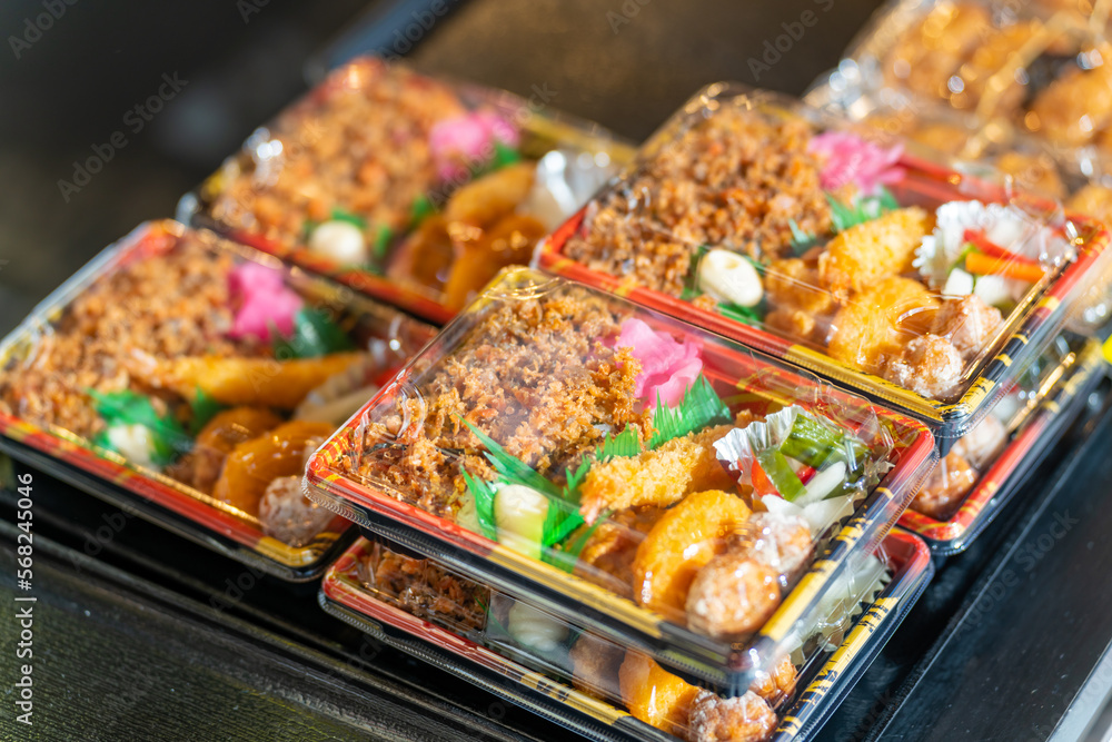 Japanese bento lunch boxes selling in convenience store. Japanese take away fast food and ready to eat on shelf in supermarket.