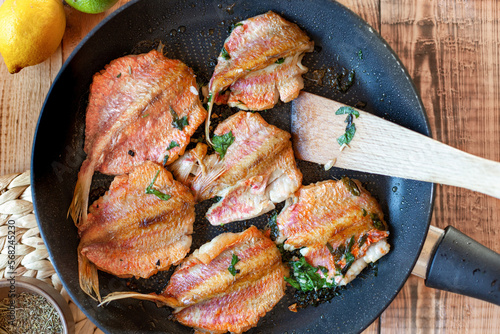 Red mullet fish cooked on a pan photo