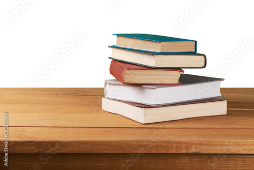 Stack of old books on the wooden deck table