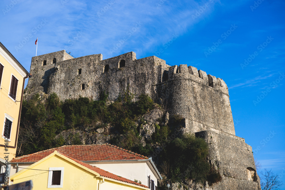 Fototapeta premium Herceg Novi town, Kotor bay, streets of Herzeg Novi, Montenegro, with old town scenery, church, Forte Mare fortress, Adriatic sea coast in a sunny day