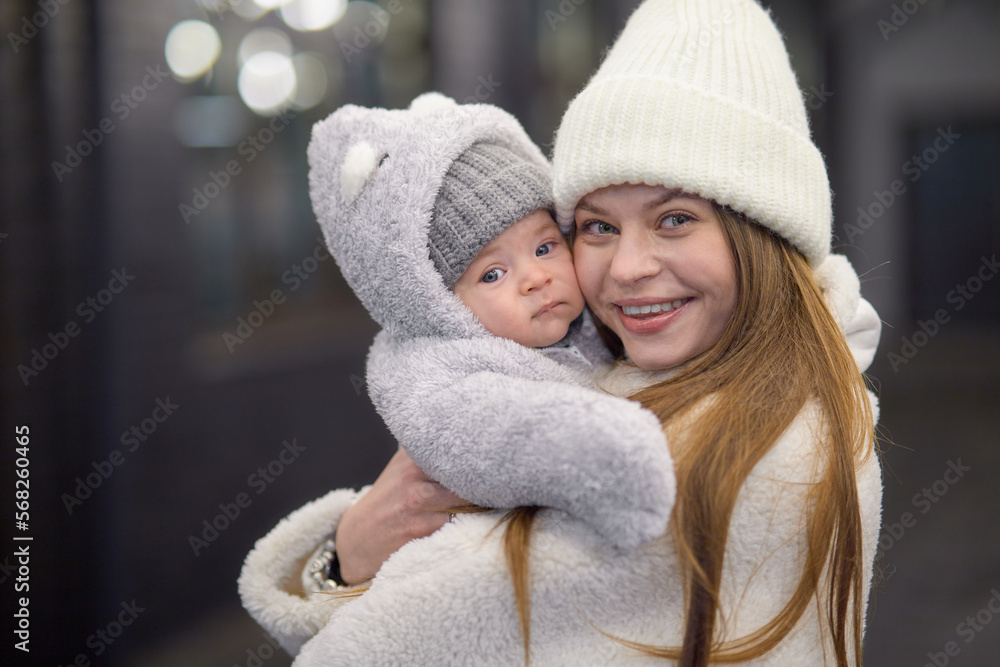 Close-up portrait of a 3-month-old baby, dressed in warm clothes for a walk on the street. Handsome baby. Close-up portrait of a 3-month-old baby, dressed in warm clothes for a walk on the street. Handsome baby.