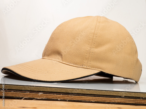 Brown baseball hat on a white background