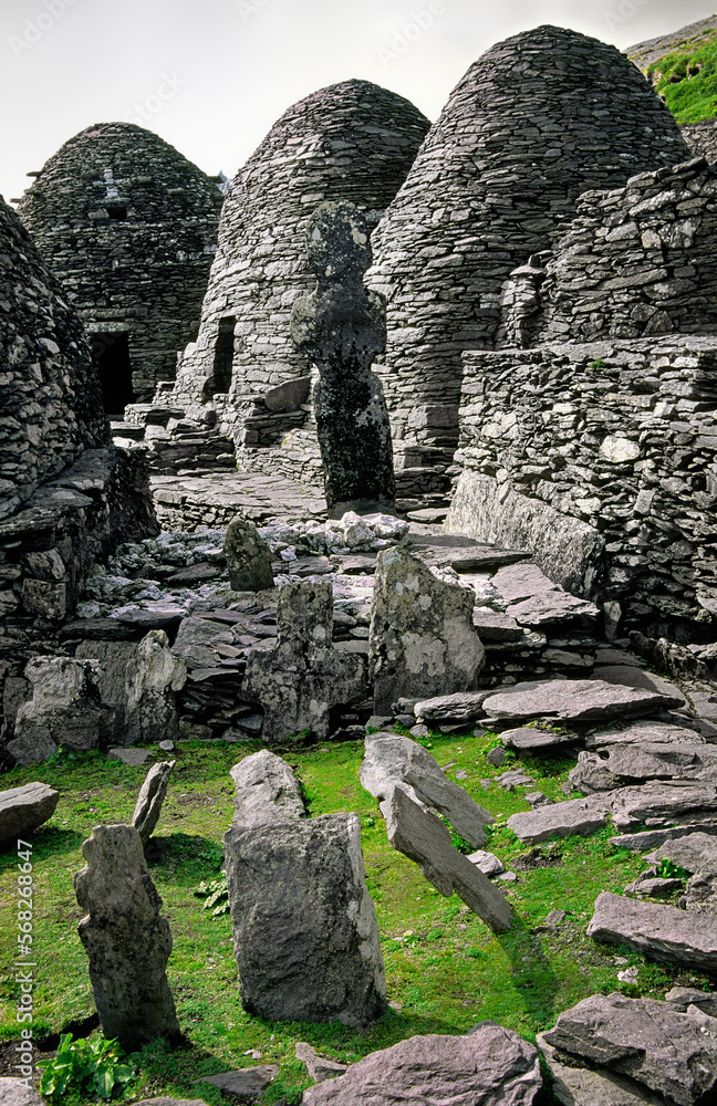 Monastic settlement at the top of the island of Skellig Michael, County Kerry, Ireland. Stone beehive huts and graveyard crosses