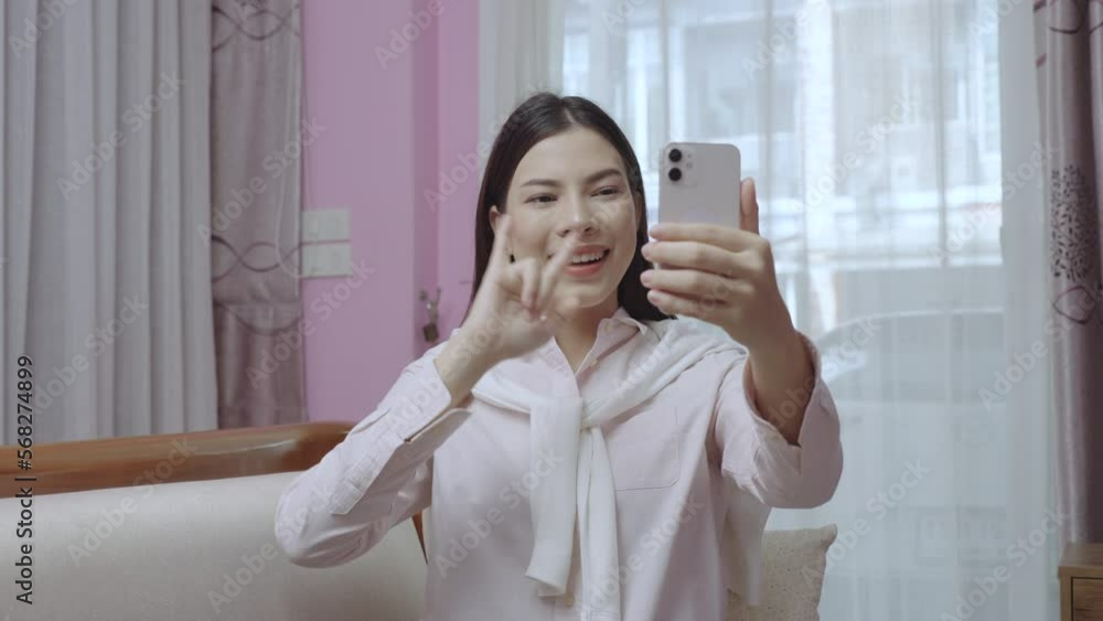 Pretty mute woman using smartphone to talk to friends via video call, 5G Wireless technology. Pretty mute woman using smartphone to talk to friends via video call, 5G Wireless technology.