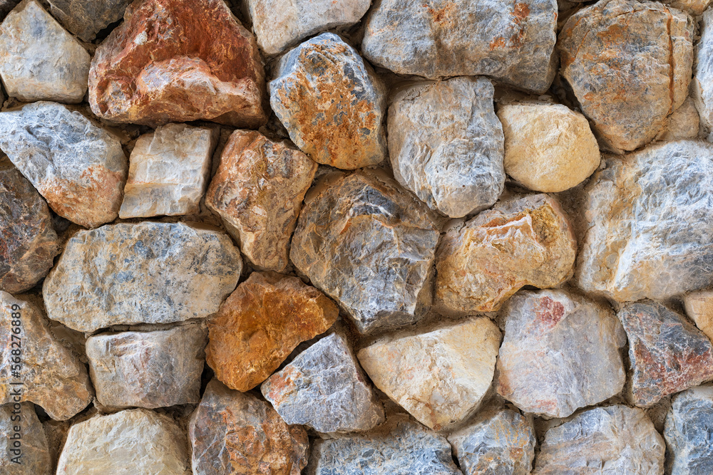 hard stones stack or modern rock wall dam and brown gray granite floor or black yellow stone jigsaw on top view for strong background or texture backdrop and wallpaper with architectural construction hard stones stack or modern rock wall dam and brown gray granite floor or black yellow stone jigsaw on top view for strong background or texture backdrop and wallpaper with architectural construction
