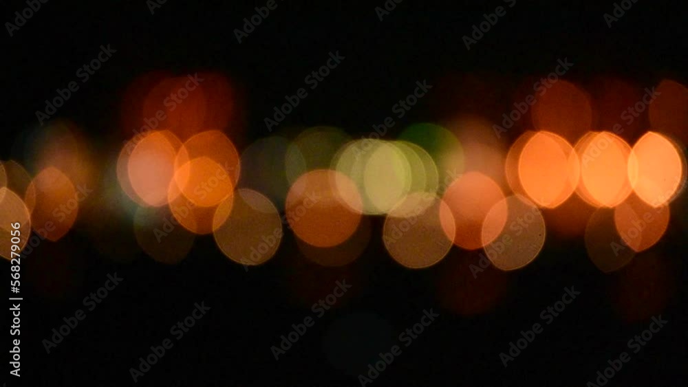 Bokeh abstract blurred background festive traffic yellow orange green red lights on road with sparkling circular animate motion 3D. Backdrop with twinkling bright shape blinking lights in modern city Bokeh abstract blurred background festive traffic yellow orange green red lights on road with sparkling circular animate motion 3D. Backdrop with twinkling bright shape blinking lights in modern city