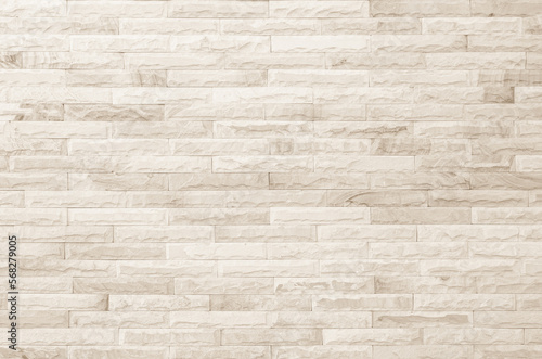 Cream and white brick wall texture background. Brickwork and stonework flooring interior rock old pattern design