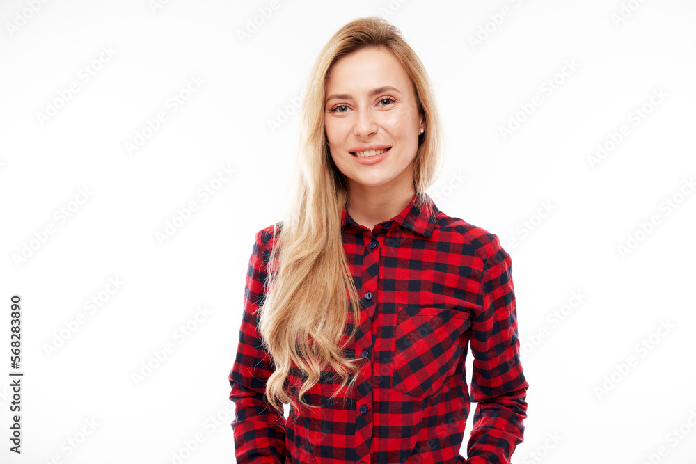 Portrait of attractive blonde girl in plaid red shirt posing and smiling joyfully isolated on white studio background Portrait of attractive blonde girl in plaid red shirt posing and smiling joyfully isolated on white studio background