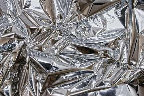 Fotografi Shiny silver foil close-up. Abstract background