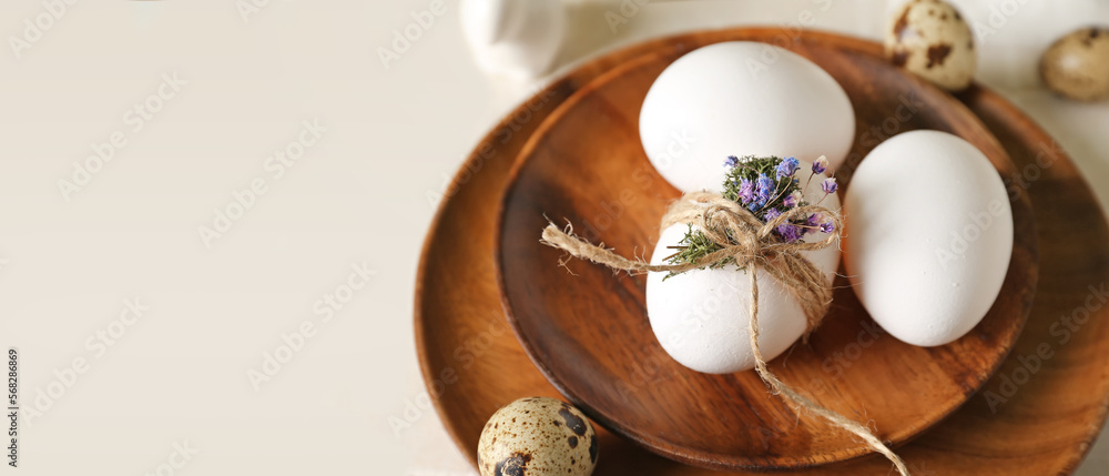 Wooden plates with Easter eggs on light table, closeup Wooden plates with Easter eggs on light table, closeup