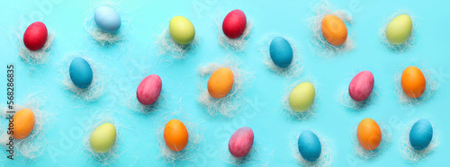 Bright painted Easter eggs on blue background