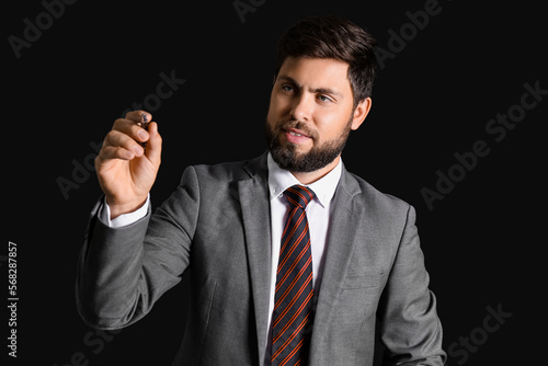 Young businessman in suit w...