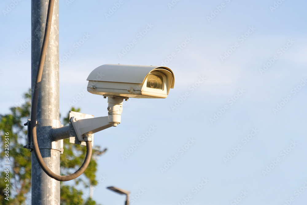 Modern public CCTV camera with clear sky background. Recording cameras for monitoring all day and night. Concept of surveillance and monitoring with copy space. Modern public CCTV camera with clear sky background. Recording cameras for monitoring all day and night. Concept of surveillance and monitoring with copy space.