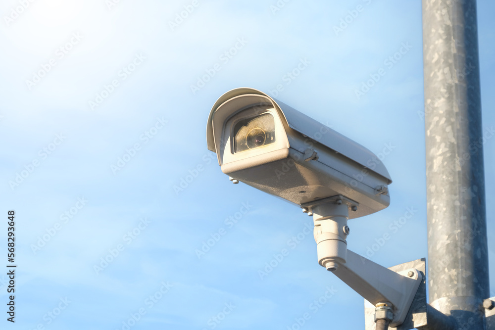 Modern public CCTV camera with clear sky background. Recording cameras for monitoring all day and night. Concept of surveillance and monitoring with copy space. Modern public CCTV camera with clear sky background. Recording cameras for monitoring all day and night. Concept of surveillance and monitoring with copy space.